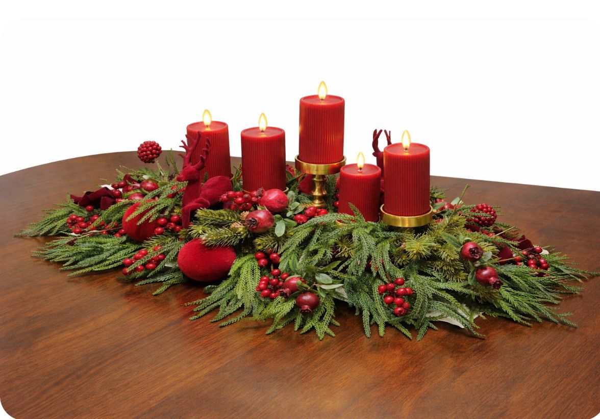 Festive candle centrepiece with greenery and red accents