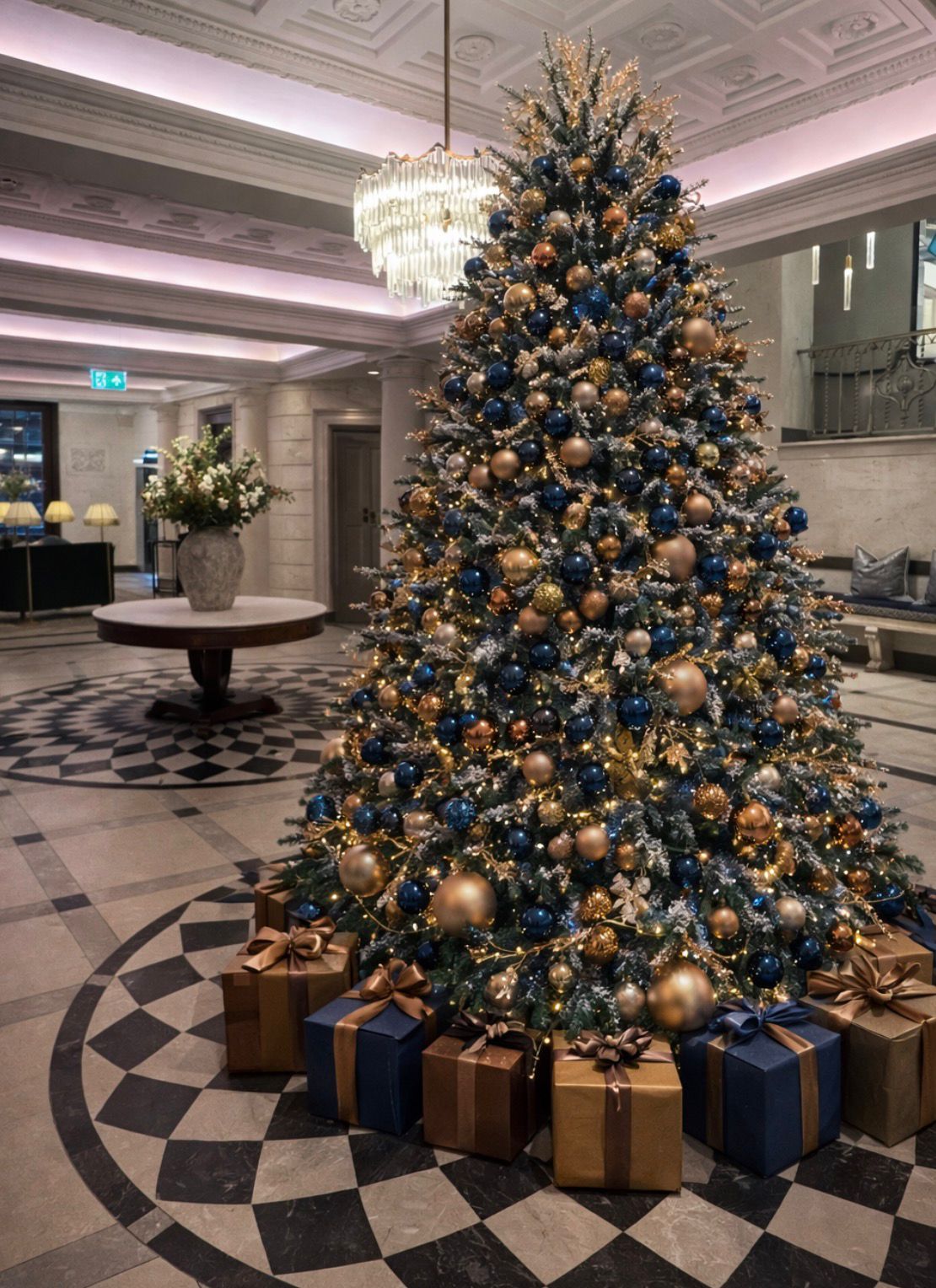 Blue and gold Christmas tree in a grand hotel lobby